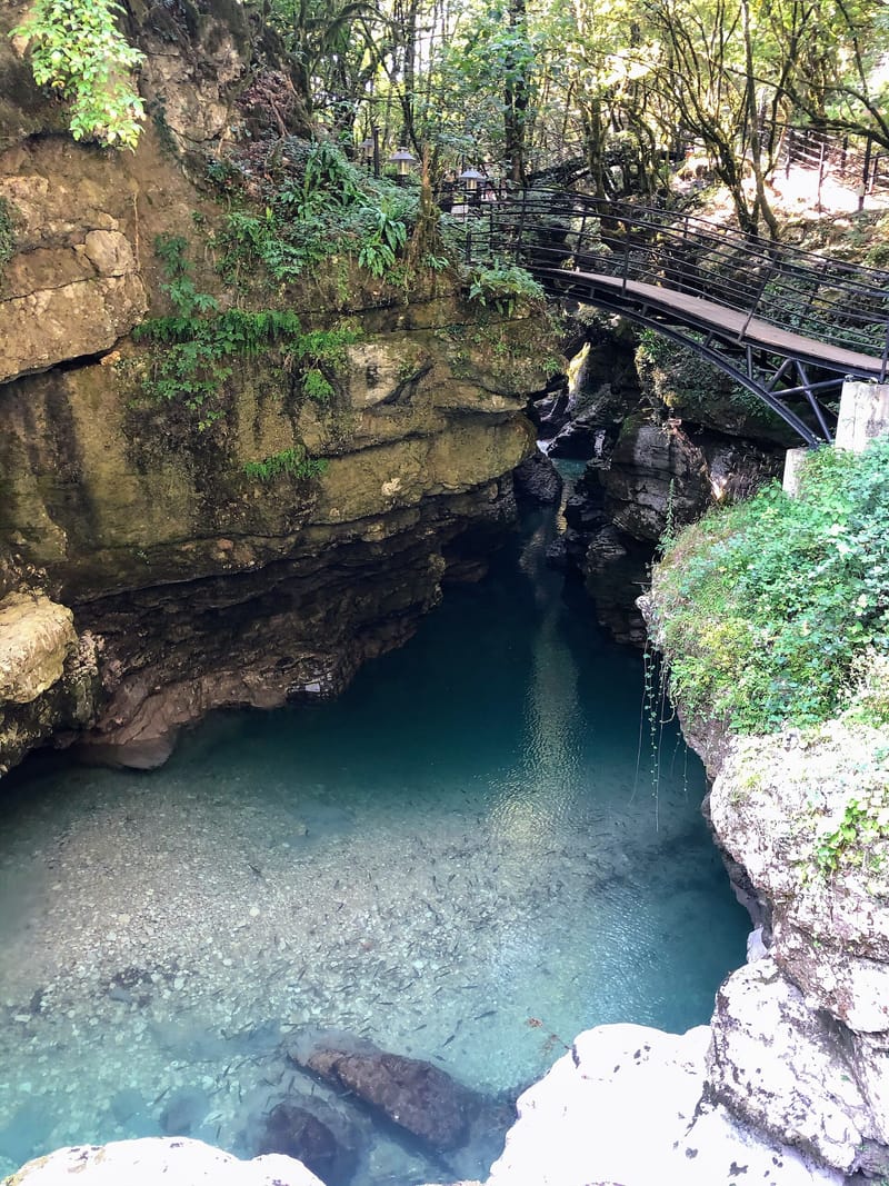 Turquoise water and steep cliffs of Martvili Canyon