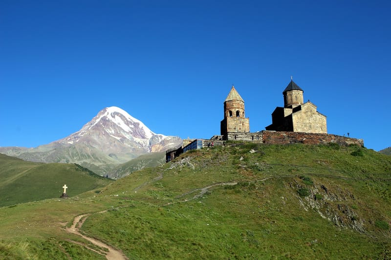 Gergeti Trinity Church with Mount Kazbek looming behind it